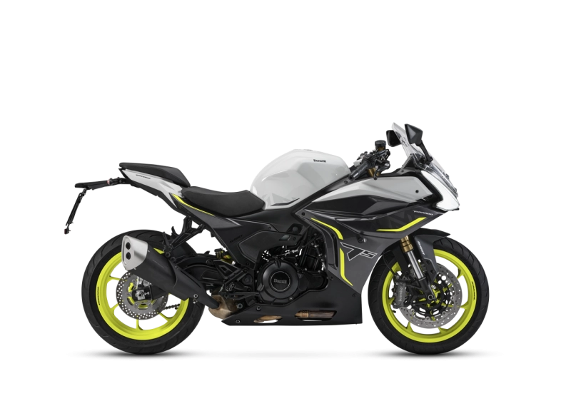 Benelli-tornado-550 3-4 - AutoBike Sport motorcycle with white and black body and neon yellow rims, shown from the side. - AutoBike