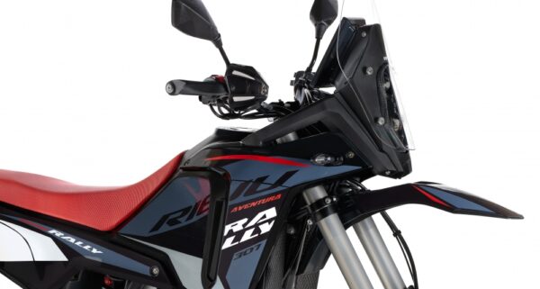 Side view of a black and red adventure motorcycle with a tall windscreen and red seat. - AutoBike