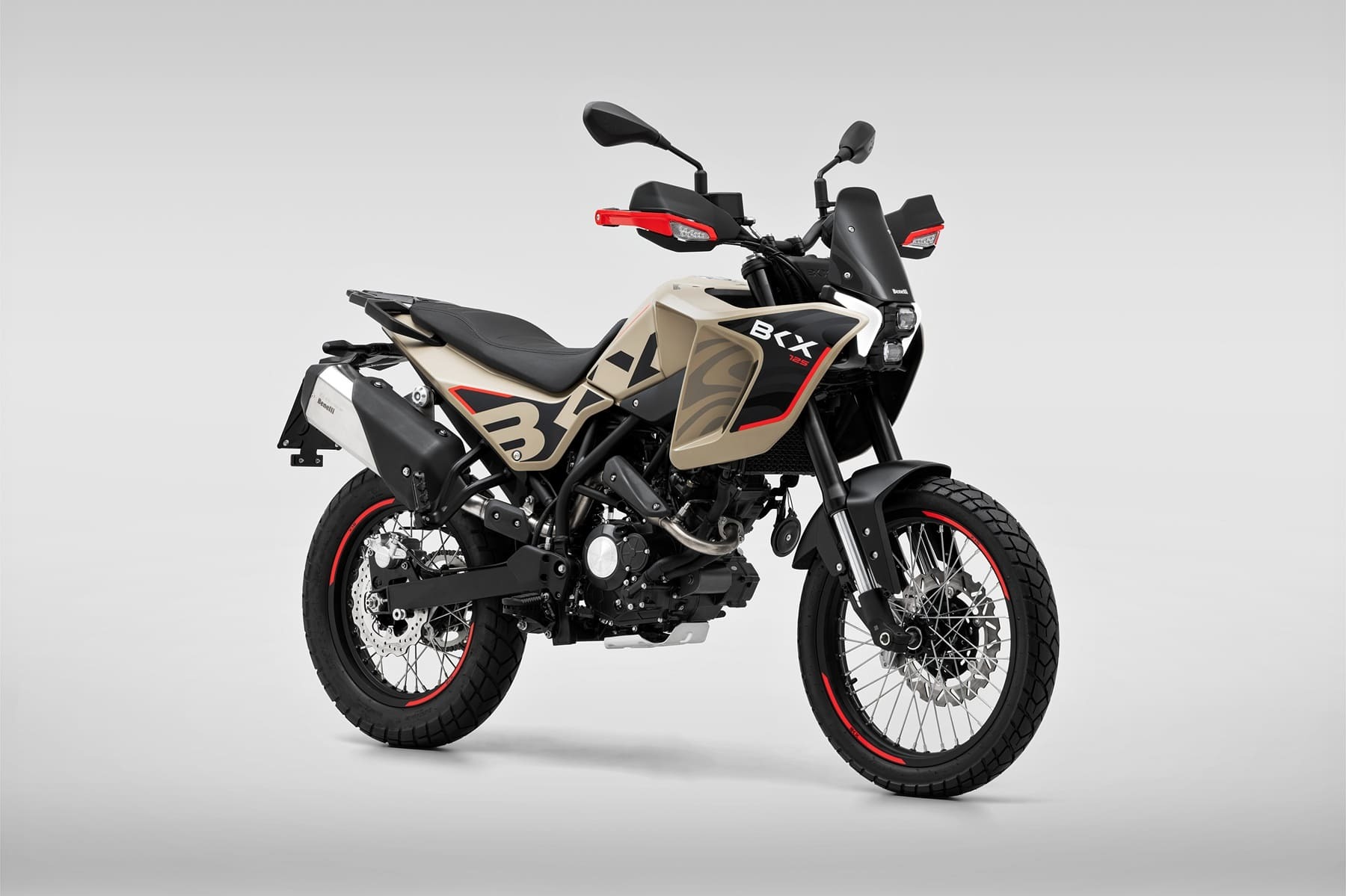Benelli-bkx-125-s 3 - AutoBike Side view of a beige and black Benelli BKX 125 motorcycle with red accents against a neutral gray backdrop. - AutoBike