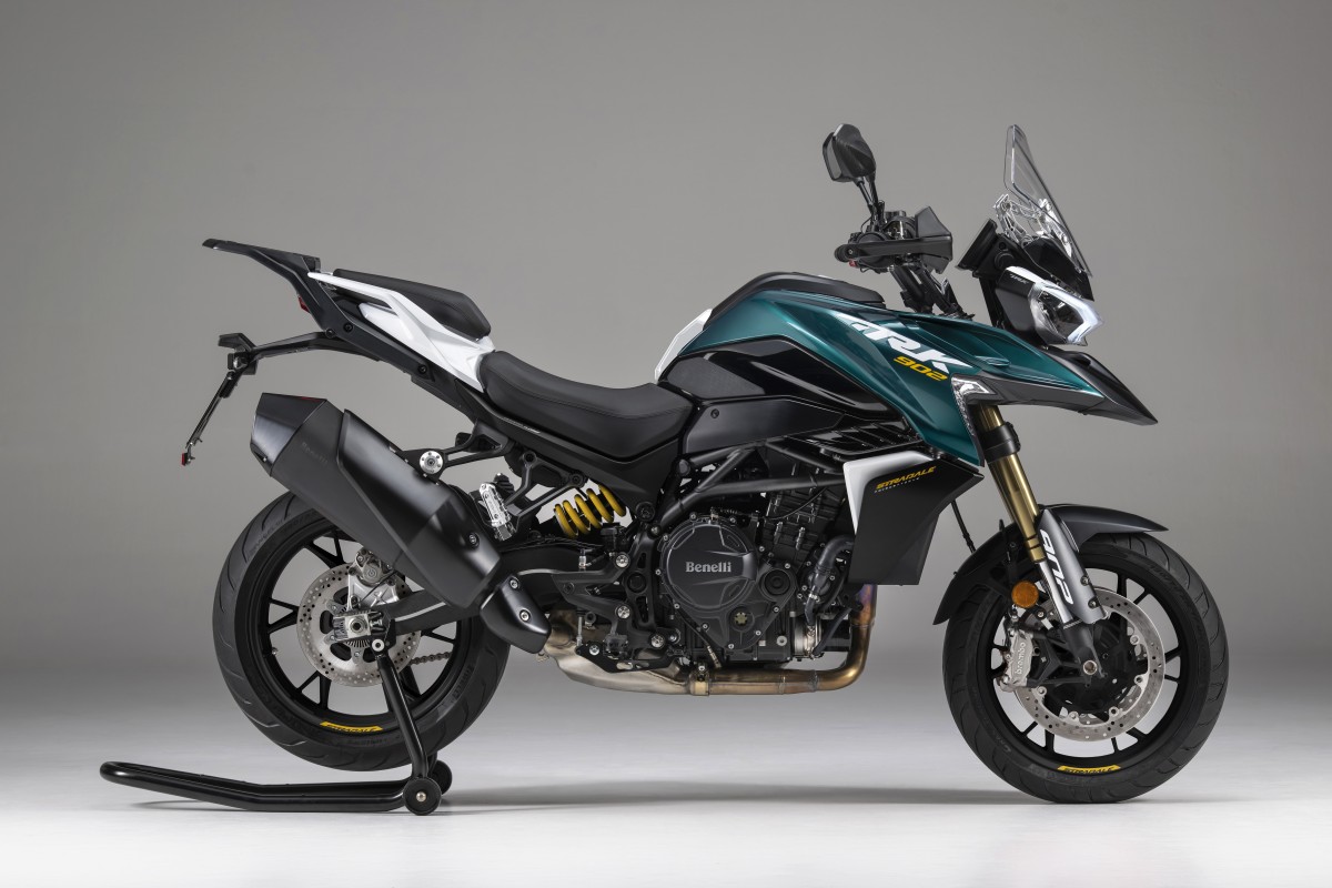 benelli-trk-902-stradale-3 - AutoBike Teal and black Benelli motorcycle on a paddock stand in a studio setting. - AutoBike